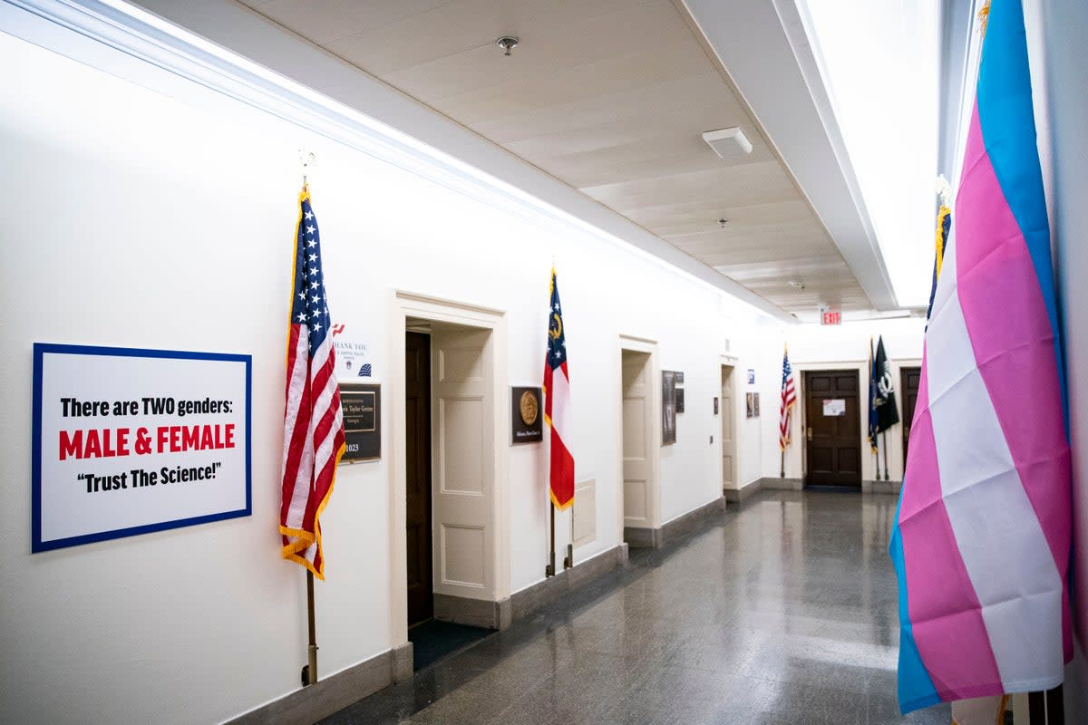 US Rep Marjorie Taylor Greene posted a sign outside her office in response to a Transgender Pride flag outside the office of then-US Rep Marie Newman, whose daughter is trans, in 2021. (Getty Images)