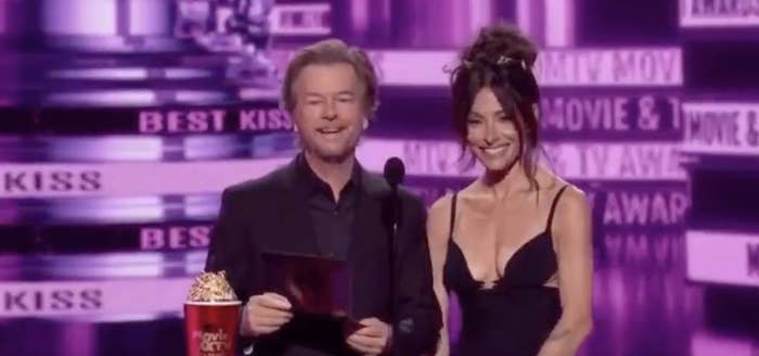 David Spade at the podium with his co-presenter