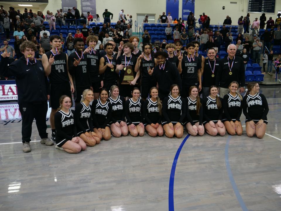 The Randall Raiders pose together after winning the 4A regional championship game against Canyon on Saturday, March 4, 2023 at Rip Griffin Center in Lubbock.