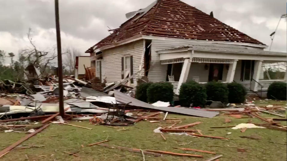 Debris and a damaged house seen following a tornado in Beauregard, Alabama, U.S. in this March 3, 2019 still image obtained from social media video. (Photo: Scott Fillmer /via Reuters)