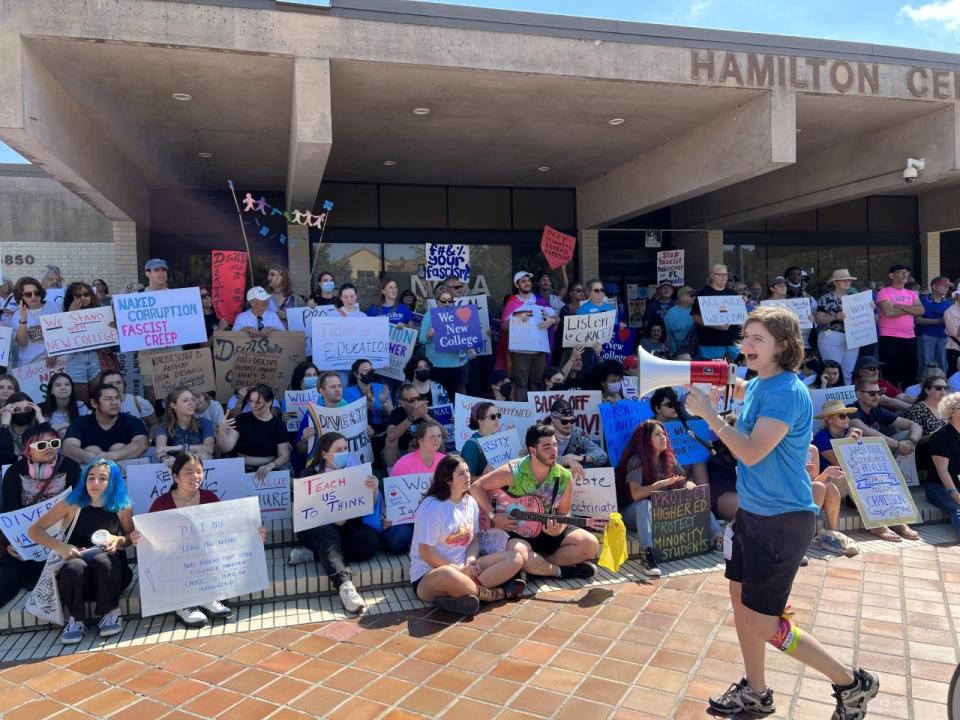 New College students protest before a board of trustees meeting on campus Tuesday.