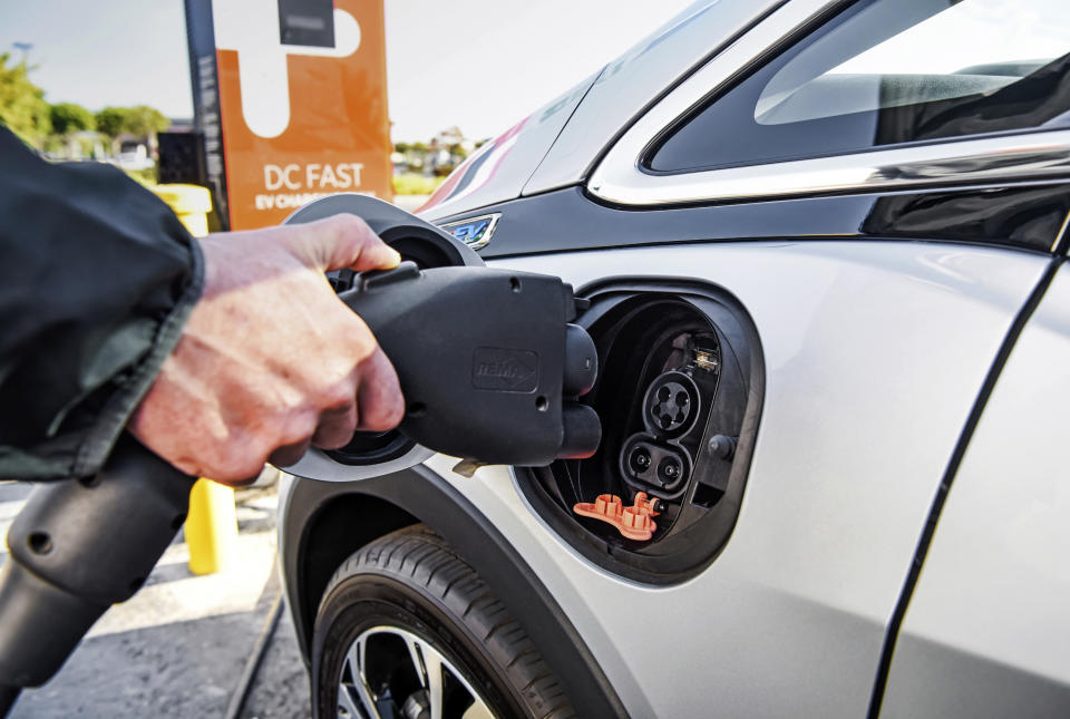 This photo provided by General Motors shows the combined charging system or CCS plug. It had been the dominant standard for EV charging until automakers decided to switch to Tesla's standard. (Jessica Lynn Walker/Courtesy of General Motors via AP)