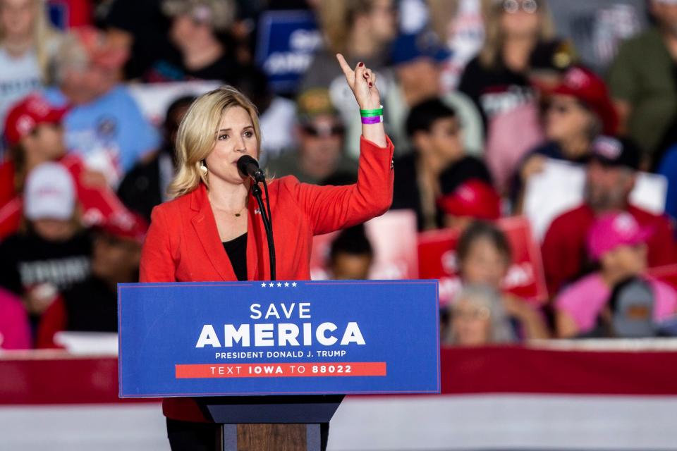 U.S. Rep. Ashley Hinson speaks at a rally with former President Donald Trump on Oct. 9, 2021, in Des Moines.