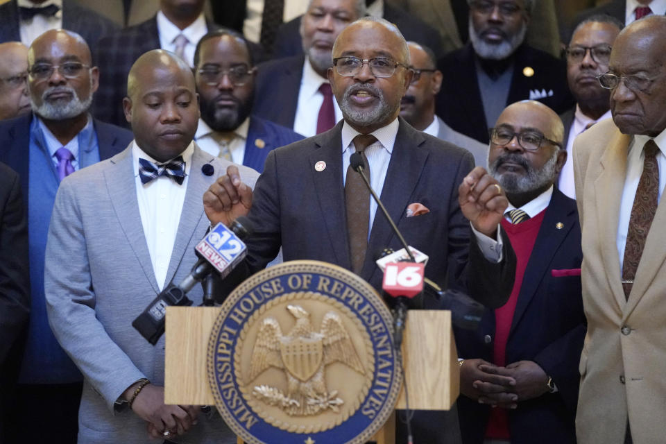 Rep. Robert Johnson, D-Natchez, center, and other Democratic legislative leaders criticize the Republican leadership's inaction on addressing the state's hospital crisis, during a news conference at the Mississippi Capitol in Jackson on Thursday, Feb. 2, 2023. Mississippi Gov. Tate Reeves said expanding Medicaid to people who work low-wage jobs that don’t provide private health insurance would be in the best interest of the state, but has refused to support the policy for political reasons, a former chancellor of the University of Mississippi said Thursday. (AP Photo/Rogelio V. Solis)