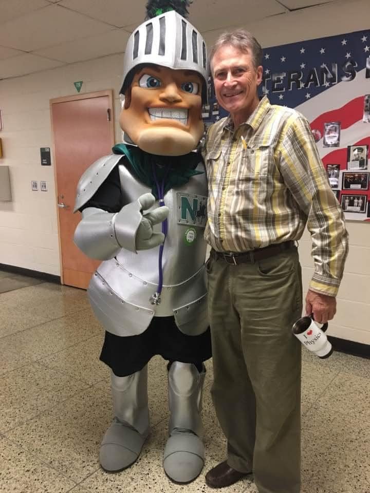 John O'Brien stands with the Nordonia Knight. O'Brien, a science teacher with Nordonia High School for nearly 25 years, died last month.