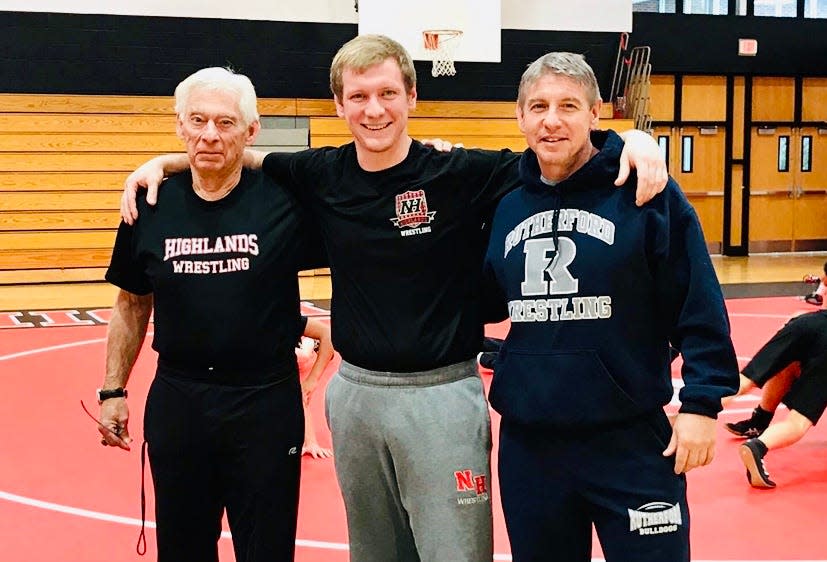 From left to right: Bucky, Dan and Jeff Rehain are re-united at the annual wrestling match between Northern Highlands and Rutherford.