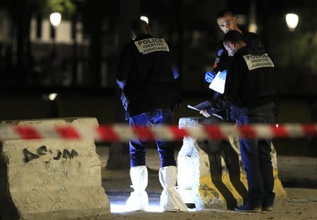 Police investigators work on the scene after seven people were wounded in knife attack downtown Paris, France, September 10, 2018. REUTERS/Gonzalo Fuentes