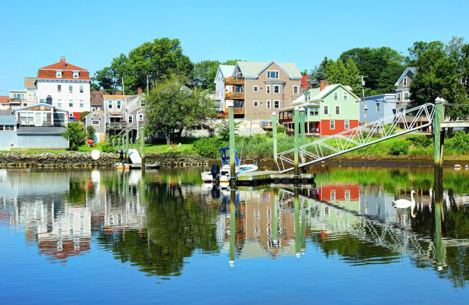 A marina and houses on a sunny day in Pawtuxet Village, Rhode Island.