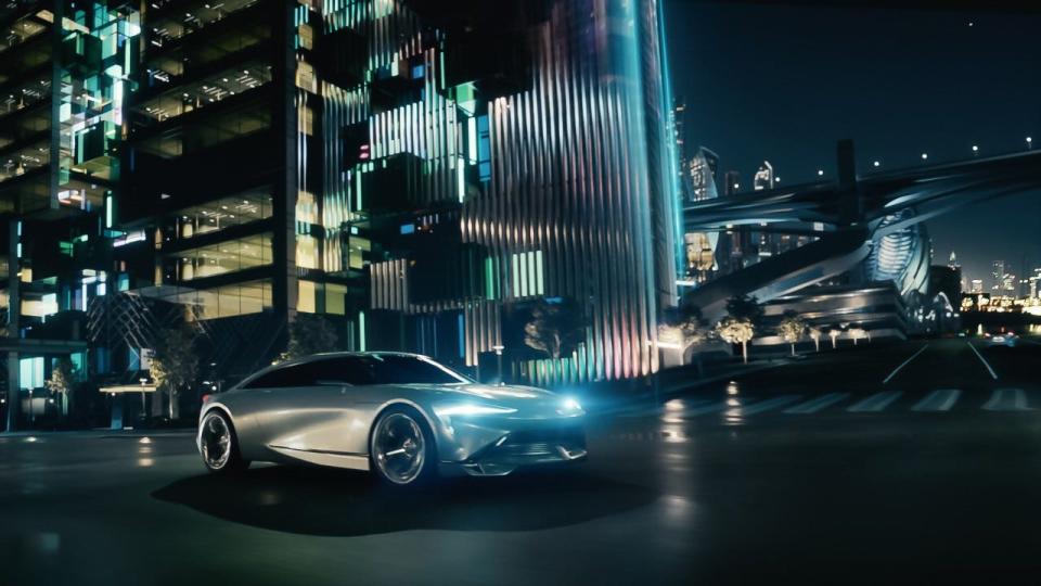 Front three-quarter view of the Buick Wildcat EV concept vehicle in a futuristic city as shown in the brand’s “Dream with Us” campaign that it launched Aug. 17, 2022. Actress Reese Witherspoon voices the spot in an ongoing partnership with Buick.