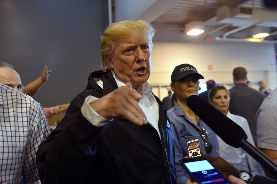 <p>President Donald Trump and First Lady Melania Trump speak to the press while visiting Hurricane Harvey victims at NRG Center in Houston on Sept. 2, 2017. (Photo: Nicholas Kamm/AFP/Getty Images) </p>