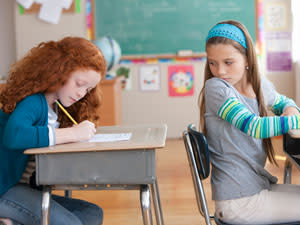 child cheating in a classroom