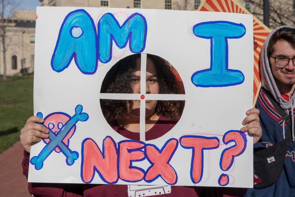 A student from Baltimore, Maryland, holds a protest sign during the March For Our Lives Rally in Washington.