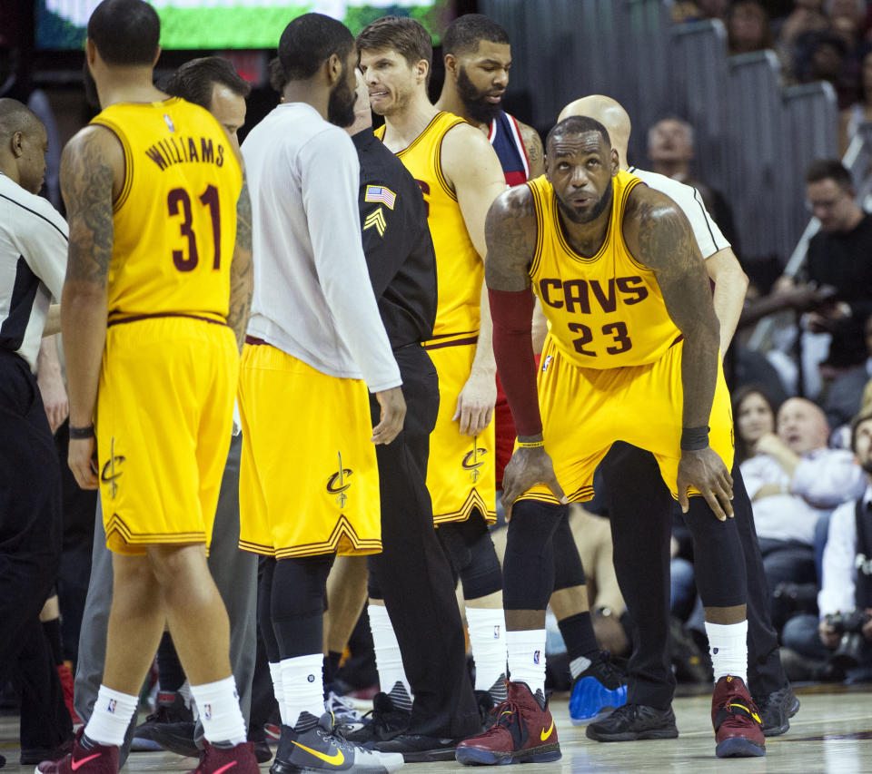 Cleveland Cavaliers' LeBron James (23) catches his breath after being hit in the groin, during the second half of an NBA basketball game against the Washington Wizards in Cleveland, Saturday, March 25, 2017. The Wizards won 127-115. (AP Photo/Phil Long)