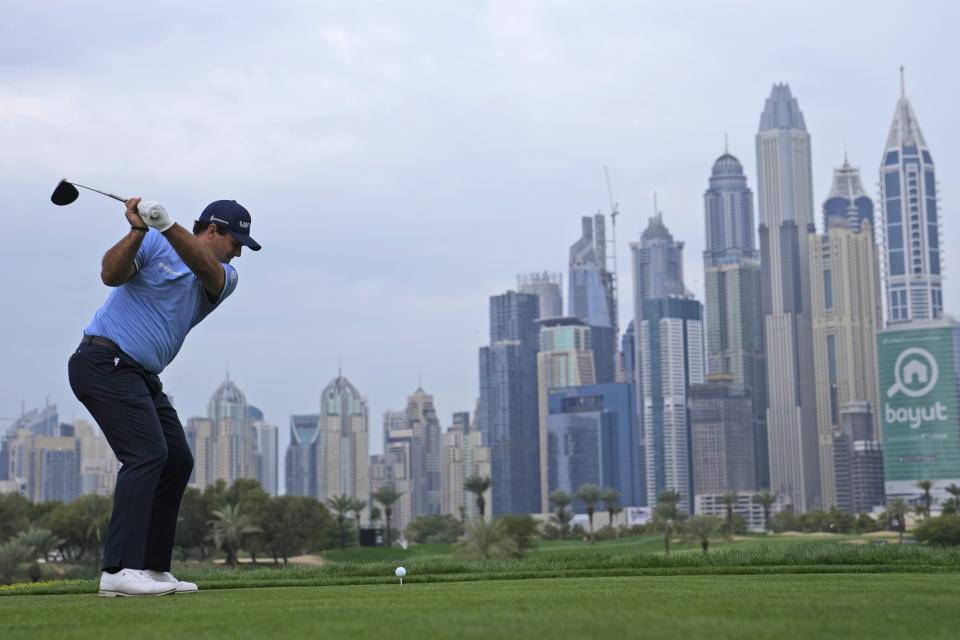 Patrick Reed of The United States tees off on the 8th hole during the first round of the Dubai Desert Classic, in Dubai, United Arab Emirates, Thursday, Jan. 26, 2023. (AP Photo/Kamran Jebreili)