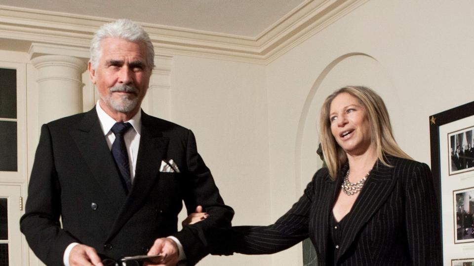 Barbra Streisand (R) pulls on her husband actor James Brolin's arm while arriving at the White House for a state dinner 19, 2011 in Washington, DC. President Barack Obama and first lady Michelle Obama are hosting resident Hu Jintao for a state dinner during his visit to the United States
