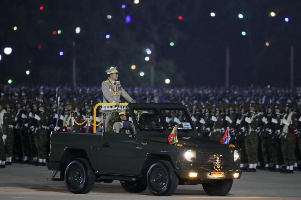 Senior Gen. Min Aung Hlaing, head of the military council, inspects officers during a parade to commemorate Myanmar's 79th Armed Forces Day, in Naypyitaw, Myanmar, Wednesday, March 27, 2024. (AP Photo/Aung Shine Oo)