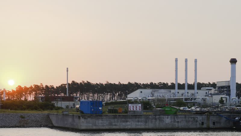 The sun rises behind the landfall facility of the Nord Stream 1 Baltic Sea pipeline and the transfer station of the OPAL gas pipeline, the Baltic Sea Pipeline Link, in Lubmin, Germany, Thursday, July 21, 2022. A New York Times report revealed information about who could be responsible for the attack.