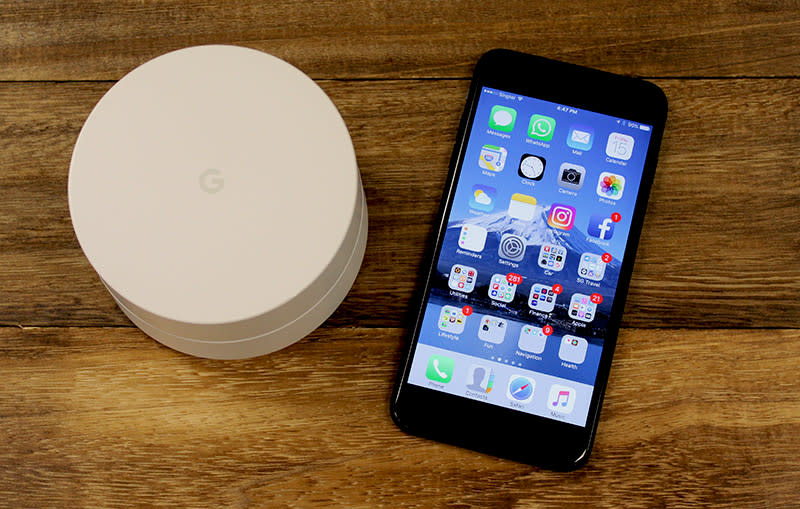 This is a Google Wifi node next to an iPhone 7 Plus.