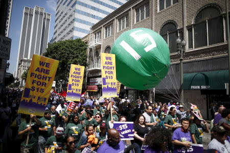 People protest for a $15-an-hour nationwide minimum wage in Los Angeles, California, United States, April 14, 2016. REUTERS/Lucy Nicholson