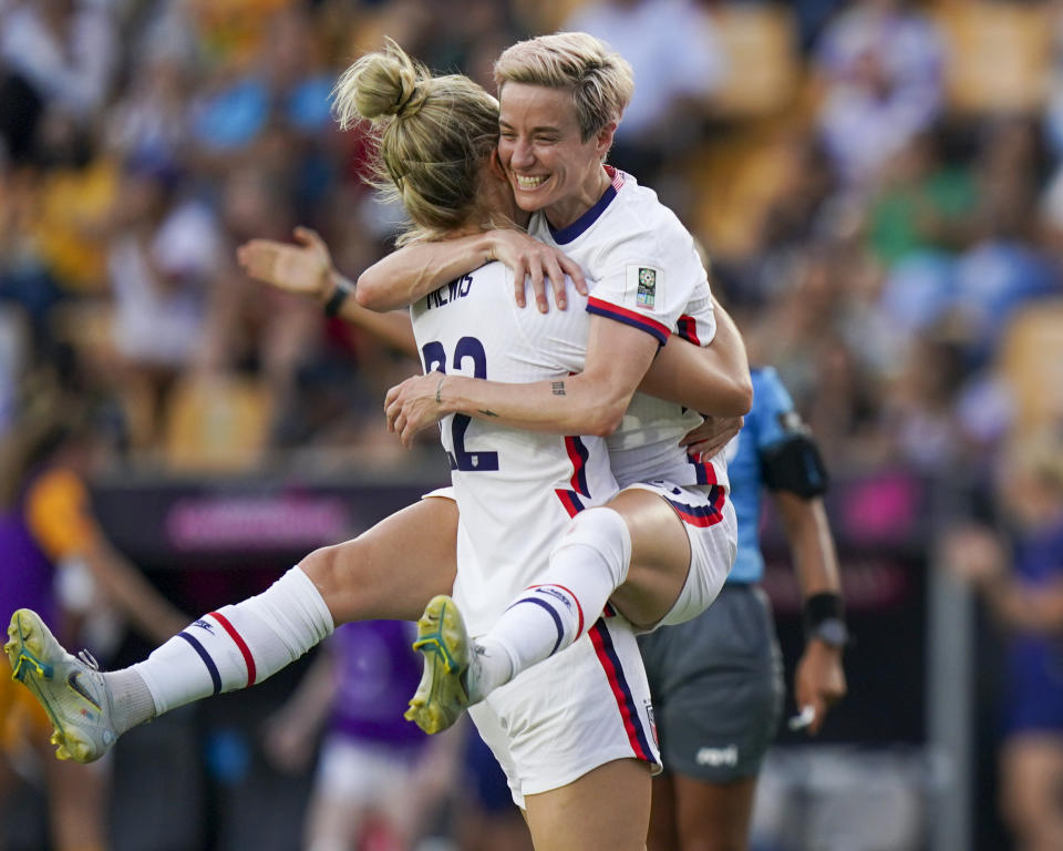 FILE - United States' Kristie Mewis, left, and Megan Rapinoe celebrate their side's third goal scored by Ashley Sanchez against Costa Rica during a CONCACAF Women's Championship soccer semifinal match in Monterrey, Mexico, Thursday, July 14, 2022. (AP Photo/Fernando Llano, File)