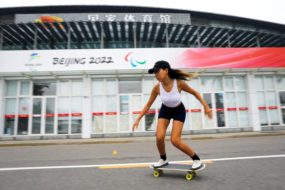 Duo Lan rides a skateboard during a free weekly training session in Beijing (Reuters)