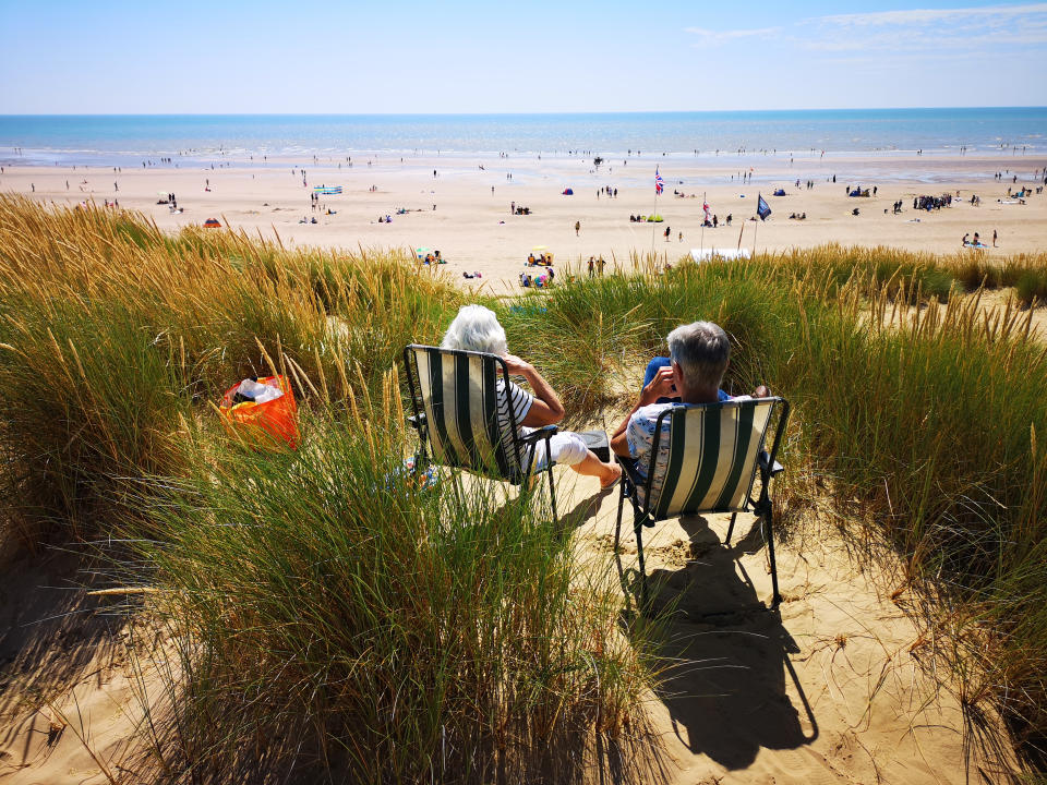 File photo dated 29/7/2019 of people enjoy the warm weather at Camber, East Sussex. The record-breaking July heatwave in central and western Europe would have been up to 3C (5.5F) cooler if the climate was not changing, new research has found.