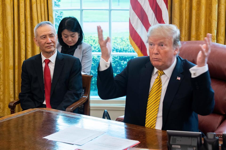 US President Donald Trump (R) speaks during a trade meeting with China's Vice Premier Liu He (L) in the Oval Office at the White House in Washington, DC, on April 4, 2019. (Photo by Jim WATSON / AFP)        (Photo credit should read JIM WATSON/AFP/Getty Images)