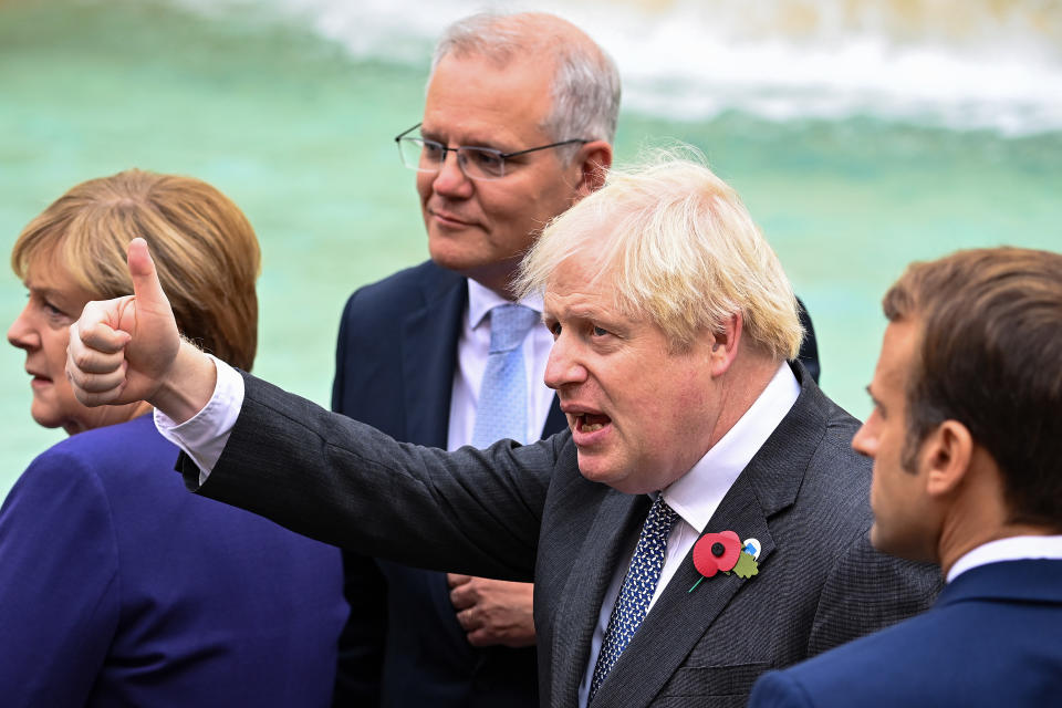 Prime Minister Boris Johnson Prime Minister Boris Johnson gives a thumbs up as he stands with Chancellor of Germany, Angela Merkel Prime Minister of Australia, Scott Morrison and French President Emmanuel Macron as they join G20 leaders during a visit to the Trevi fountain in Rome, Italy during the G20 summit