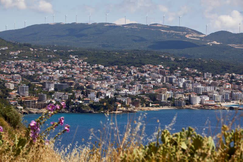 Wind turbines of the Mozura wind farm are seen on a hill in Ulcinj, Montenegro