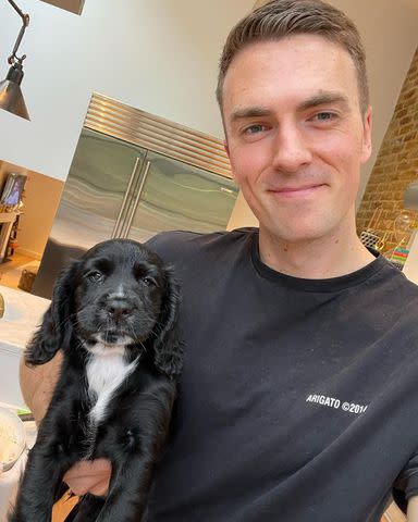 <p>Ben Alldis/Instagram</p> Peloton's Ben Alldis photographed with their puppy Jags.