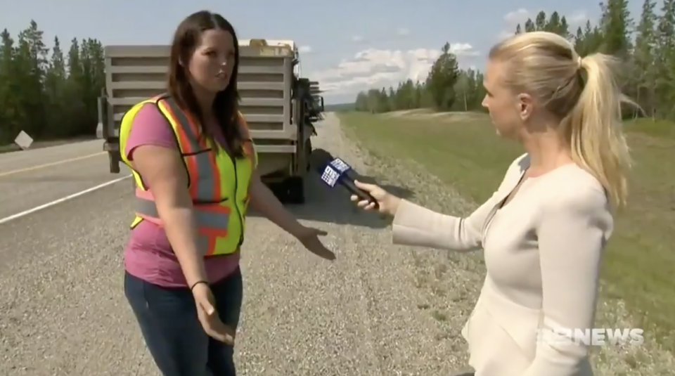 Pictured is Alandra Hull re-enacting how the man was standing on the Canadian highway with a Nine journalist.