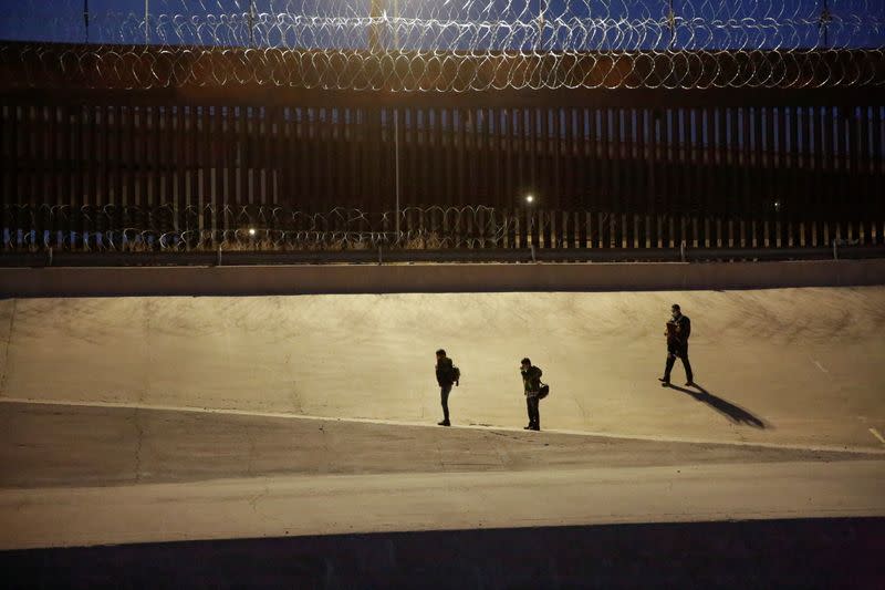 Migrants are seen after crossing the Rio Bravo river to turn themselves in to U.S. Border Patrol agents to request for asylum in El Paso, Texas, U.S., as seen from Ciudad Juarez