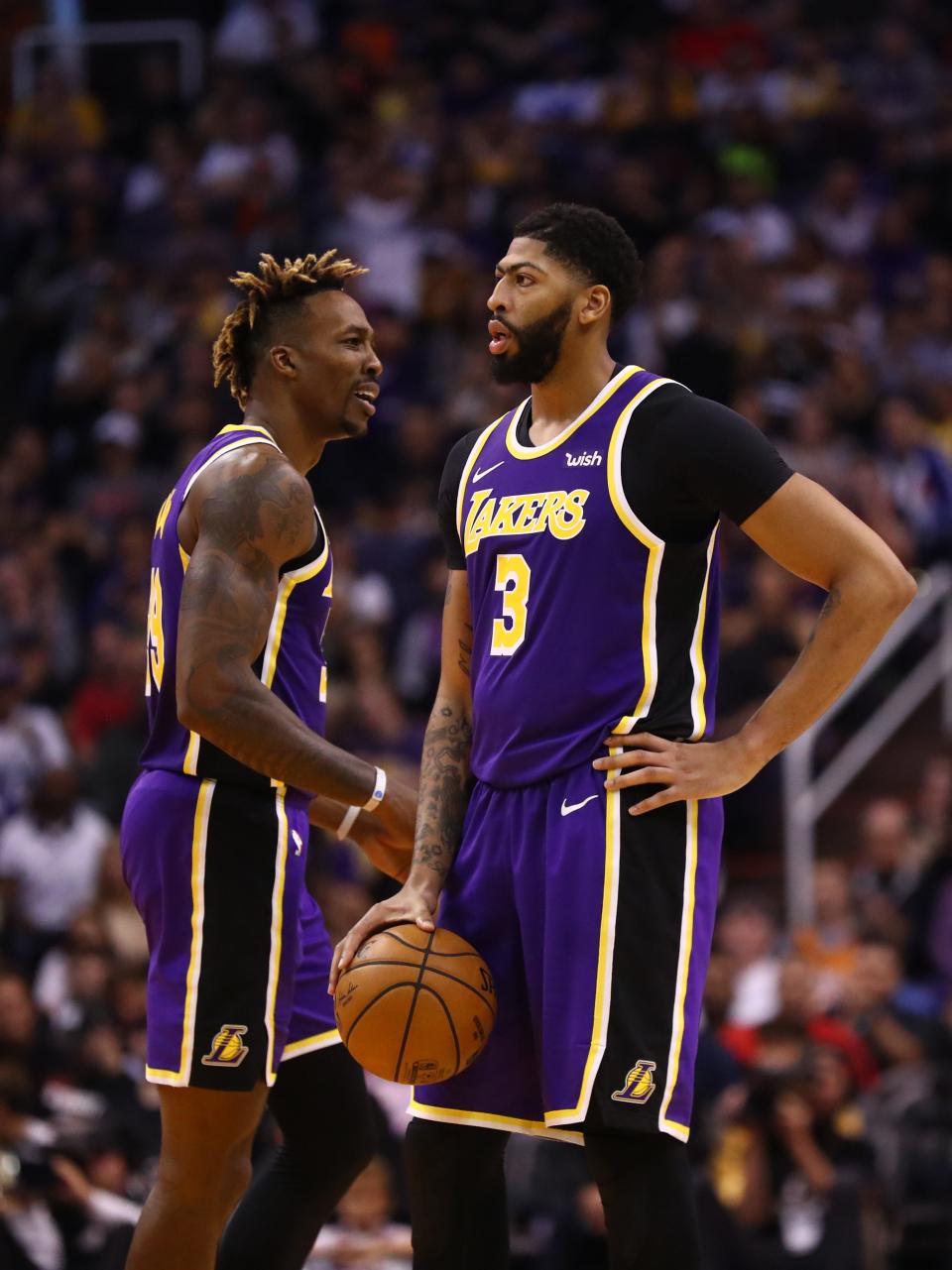 Anthony Davis and Dwight Howard got into a brief physical altercation on the Lakers bench during Friday night's game against the Suns.