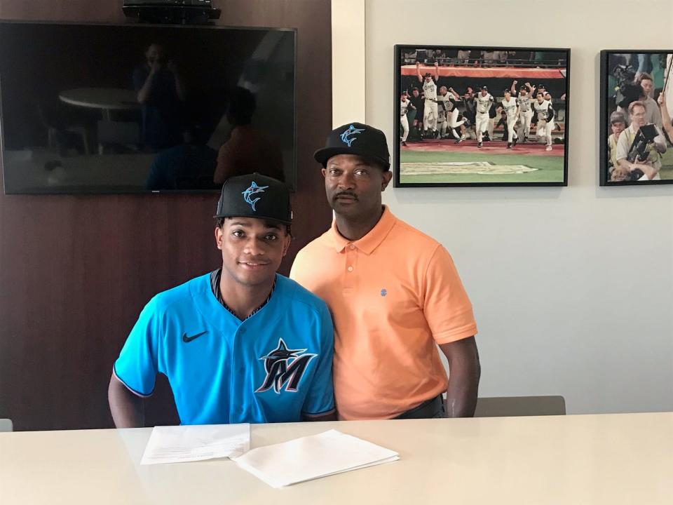 Former Pensacola Catholic infielder Jordan McCants (left) poses for a photo with his father Tori (right) after signing a professional contract with Miami Marlins on Thursday, July 22, 2021 from the Marlins training complex in Jupiter.