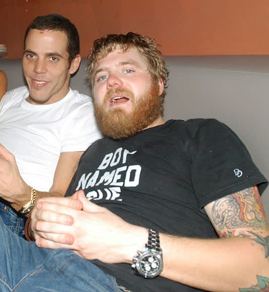 Close-up of Steve-O and Ryan sitting together