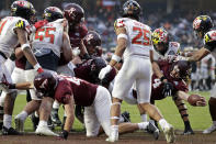 Virginia Tech quarterback Connor Blumrick (4) scores a touchdown against Maryland during the first half of the Pinstripe Bowl NCAA college football game in New York, Wednesday, Dec. 29, 2021. (AP Photo/Adam Hunger)