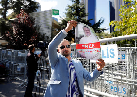 A demonstrator holds a picture of Saudi journalist Jamal Khashoggi during a protest in front of Saudi Arabia's consulate in Istanbul, Turkey, October 5, 2018. REUTERS/Osman Orsal