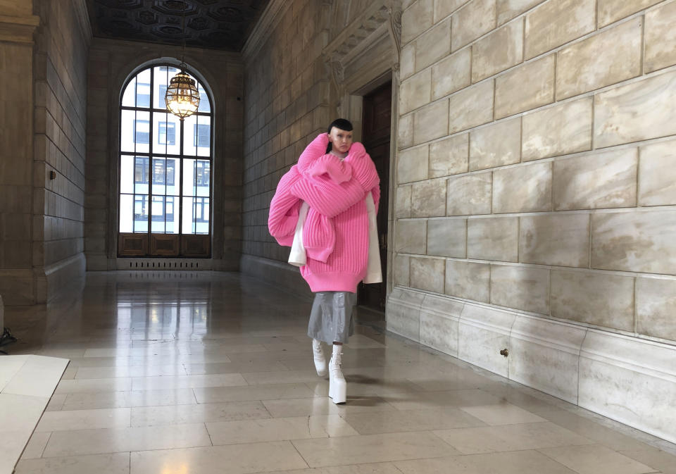 A model walks the runway during the Marc Jacobs Fall 2022 presentation at the New York Public Library on Monday, June 27, 2022, in New York. (AP Photo/Jocelyn Noveck)