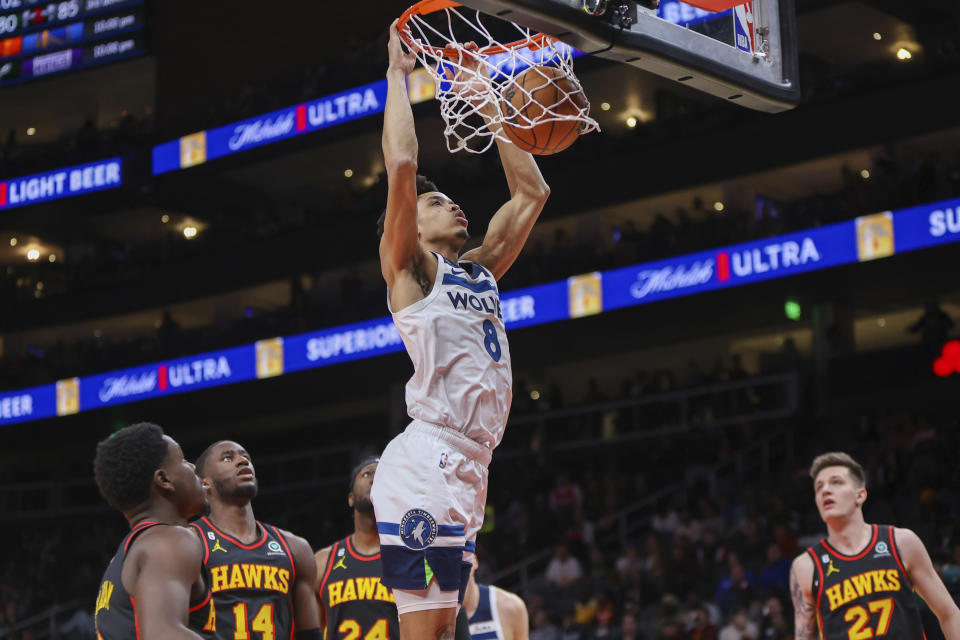 Minnesota Timberwolves forward Josh Minott (8) dunks in the second half of an NBA basketball game against the Atlanta Hawks, Monday, March 13, 2023, in Atlanta. (AP Photo/Brett Davis)