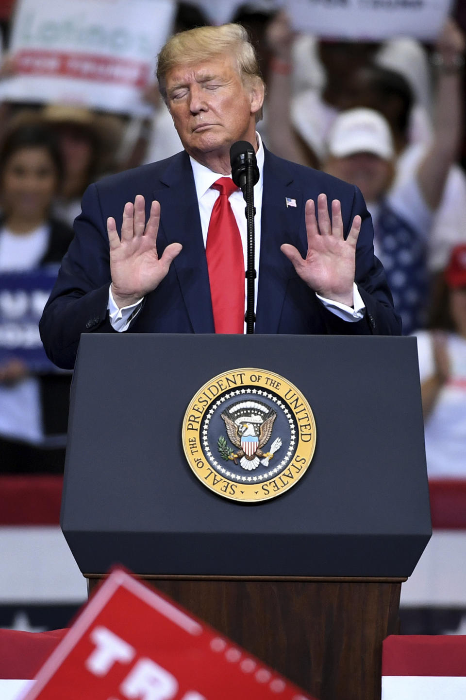 President Donald Trump does an Abraham Lincoln impersonation to display what he would look like if he acted "more presidential," during a campaign rally, Thursday, Oct. 17, 2019, at the American Airlines Center in Dallas. (AP Photo/Jeffrey McWhorter)