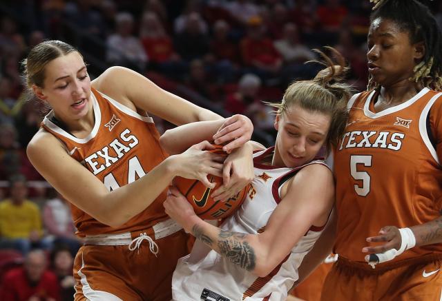 Iowa State's Denae Fritz, right, and Texas' Taylor Jones battle for a loose ball during the first quarter of Monday's game at Hilton Coliseum.