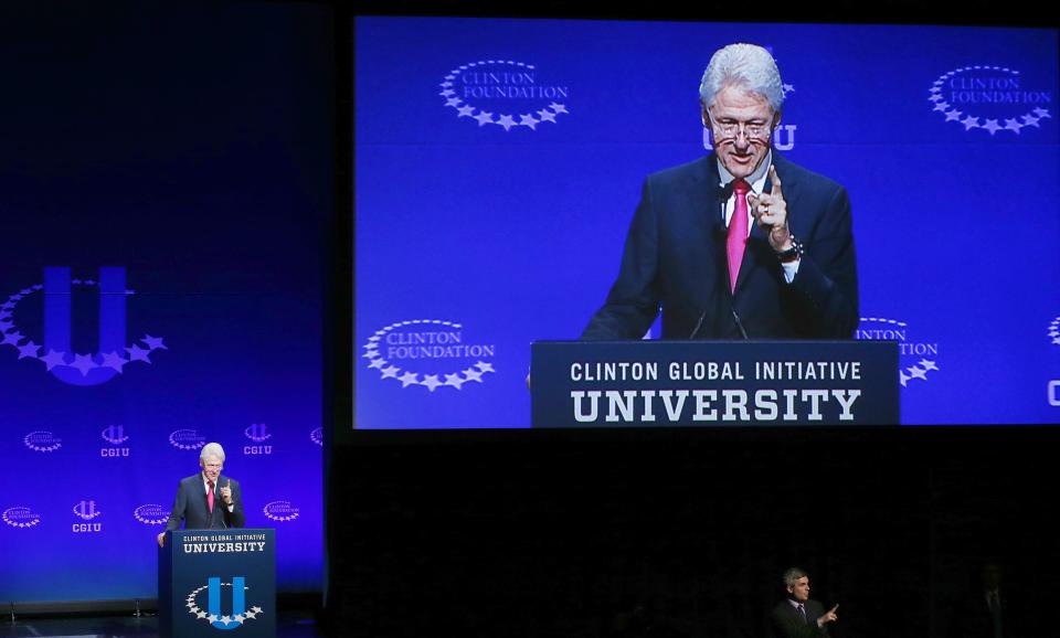 Former president Bill Clinton speaks at a student conference for the Clinton Global Initiative University at Arizona State University, Friday, March 21, 2014, in Tempe, Ariz. He joined wife Hillary Clinton and daughter Chelsea Clinton for the weekend conference. (AP Photo/Ross D. Franklin)