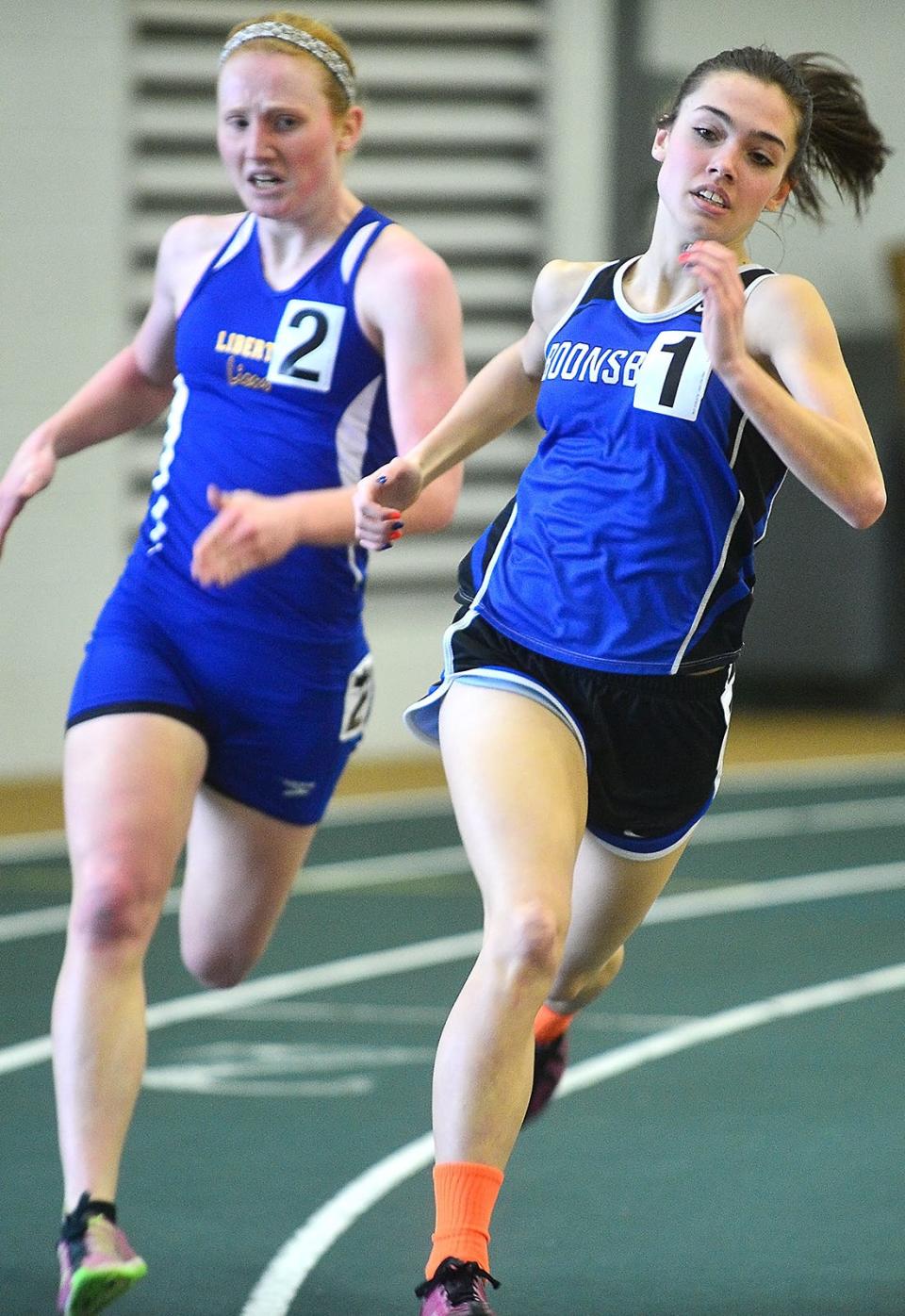 Boonsboro's Meggan Grams, right, tries to hold off Liberty's Sarah Rinehart in the girls 1,600-meter run at the Maryland Class 2A West Indoor Track & Field Championships at Hagerstown Community College. Grams is the county indoor record-holder in the 800 and 1,600.