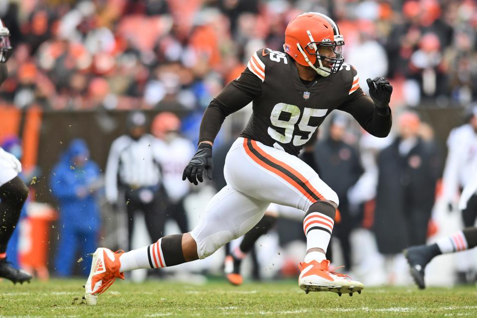 Cleveland Browns defensive end Myles Garrett runs a route during the first half of an NFL football game against the Cincinnati Bengals, Sunday, Jan. 9, 2022, in Cleveland. (AP Photo/Nick Cammett)