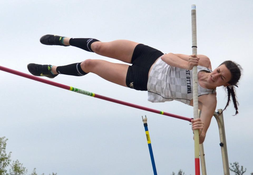 West Ottawa's Natalie Blake clears the bar at regionals in the pole vault.