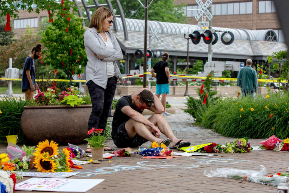 <div class="inline-image__caption"><p>Mourners react at a memorial site for the victims of the Highland Park mass shooting.</p></div> <div class="inline-image__credit">Jim Vondruska/Getty Images</div>