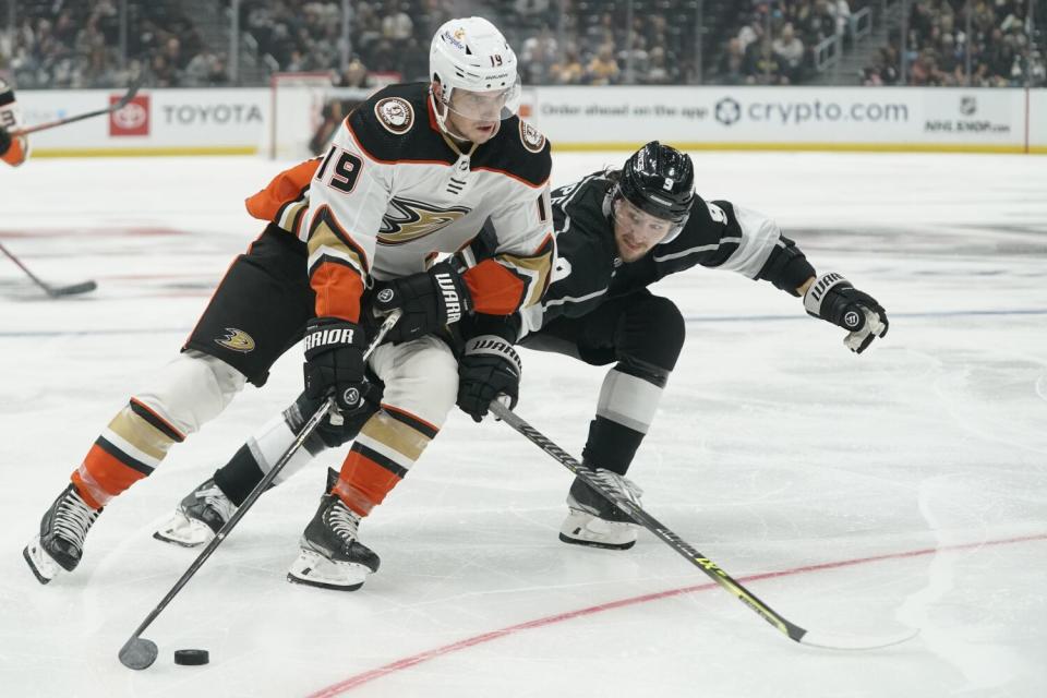 Ducks forward Troy Terry controls the puck in front of Kings forward Adrian Kempe.