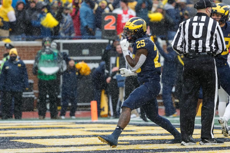 Michigan running back Hassan Haskins scores a touchdown against Ohio State during the first half at Michigan Stadium in Ann Arbor on Saturday, Nov. 27, 2021.