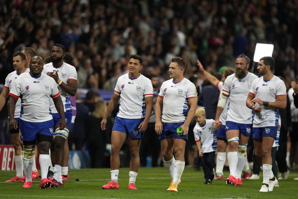 Namibia players walk around the pitch after the Rugby World Cup Pool A match between New Zealand and Namibia at the Stadium de Toulouse in Toulouse, France, Friday, Sept. 15, 2023. New Zealand won 71-3. (AP Photo/Themba Hadebe)