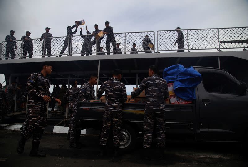 Indonesian Navy distribute logistics for people following Mount Ruang volcano eruption, in Bitung
